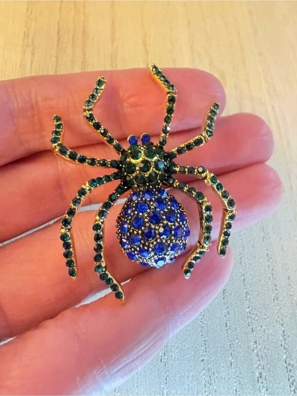 Gold-tone Spider Brooch with Blue and Green Rhinestones